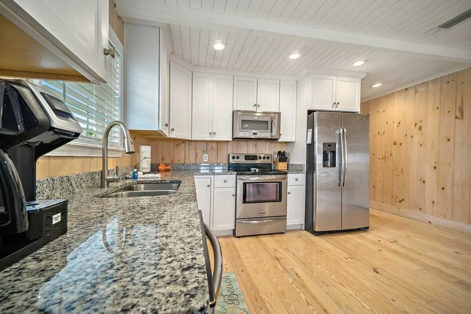 Side A. Kitchen features granite, stainless, and both a Keurig & normal coffee maker. 