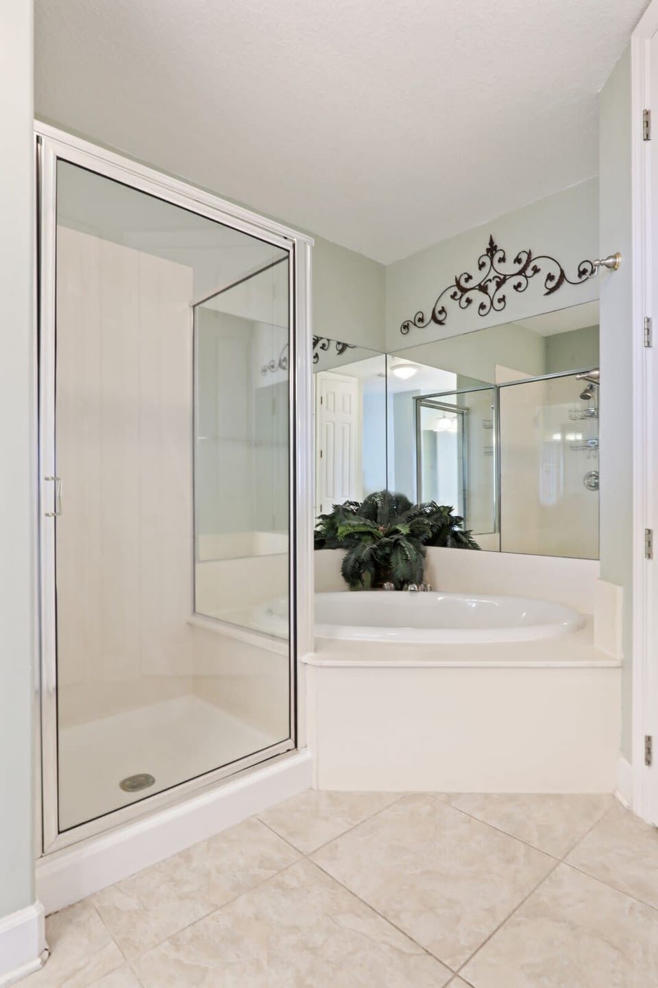 Master bath with double vanity, garden tub, and walk-in shower. 