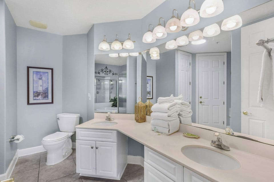 Master bath with double vanity, garden tub, and walk-in shower.