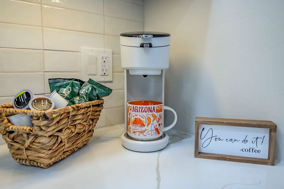 Charming coffee bar complete with all the essentials, perfect for brewing your favorite morning drinks and enjoying a cozy start to your day.