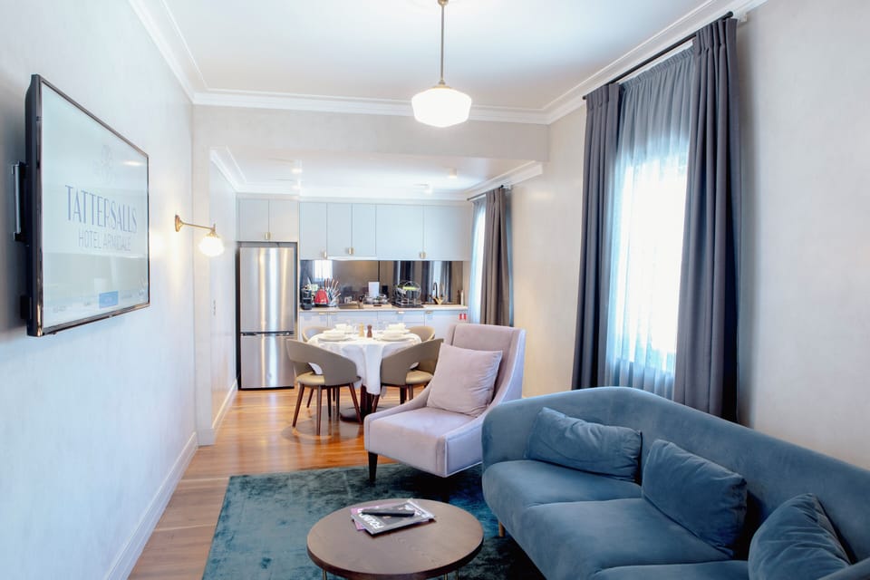 Family Apartment, 2 Bedrooms | Living area | 50-inch TV with digital channels, first-run movies, smart speakers