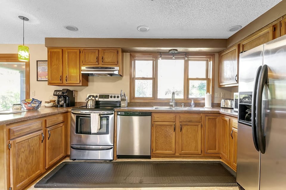 Fully equipped kitchen with plenty of space for meals, coffee, and conversation