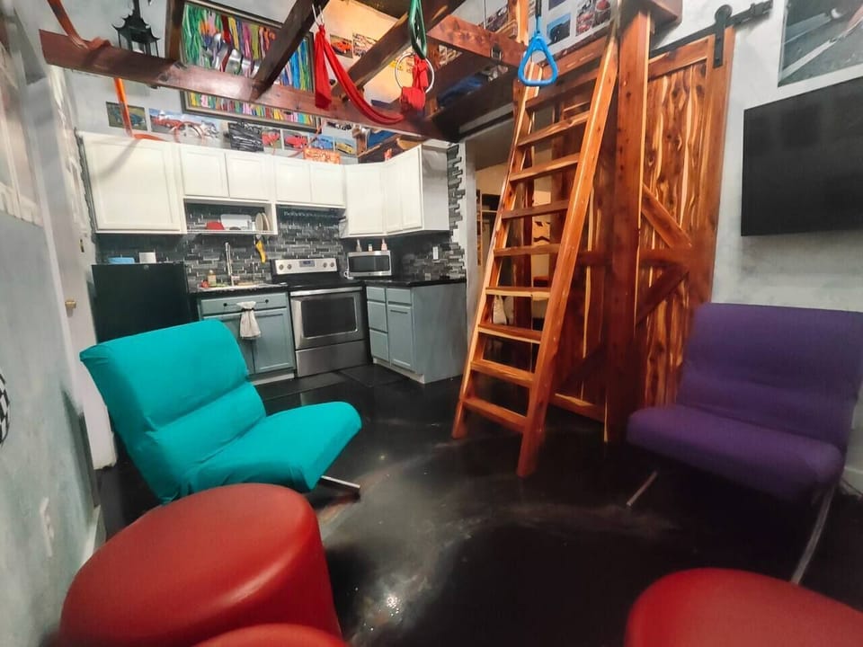 Living Room - Ladder to loft bed in view
