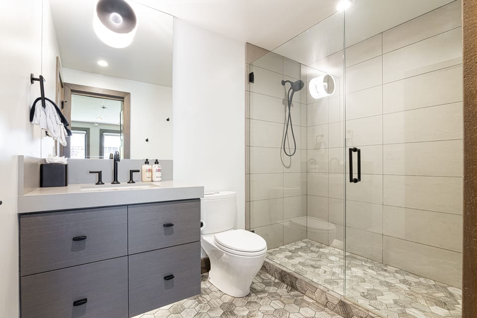 Unit F - Master En Suite 3 with a tile/glass  shower