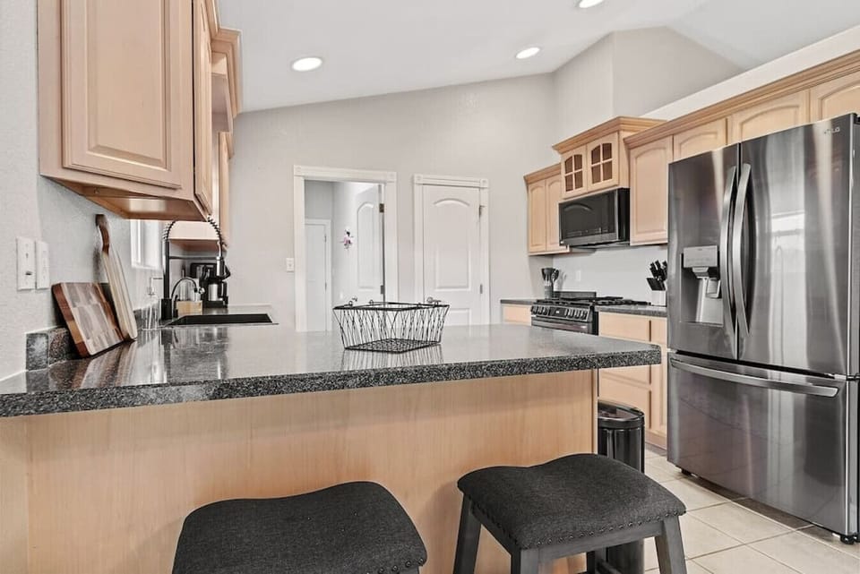 Prepare delicious meals with ease in our fully-stocked kitchen, furnished with all the essential cooking equipment you need.