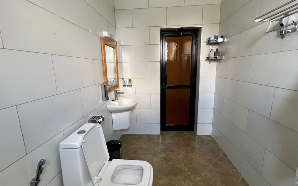 Basic Double Room | Bathroom | Rainfall showerhead, free toiletries, bathrobes, slippers