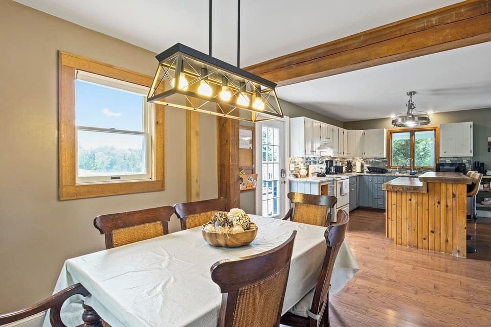 Dine in style in this inviting space that opens up to a modern kitchen, perfect for entertaining and family meals.