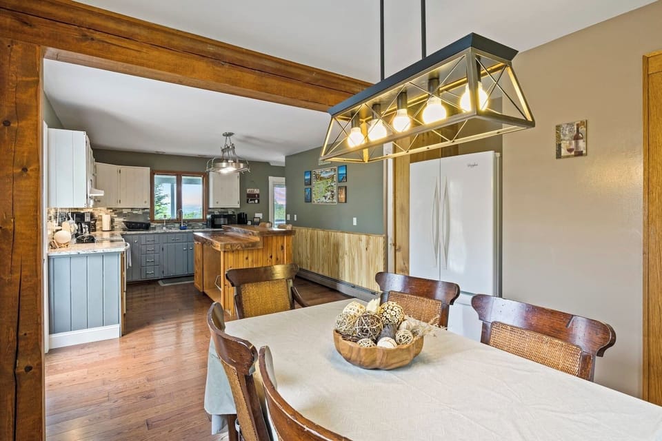 Enjoy meals in this cozy dining area that seamlessly connects to a spacious kitchen with modern appliances and ample counter space.
