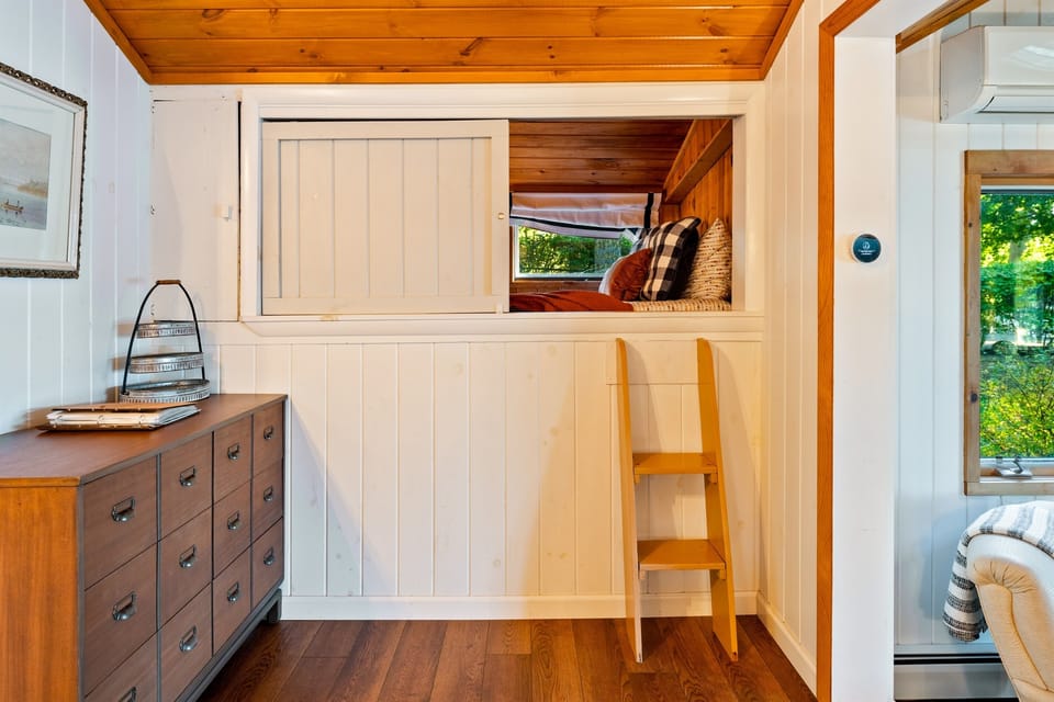 A charming and cozy nook featuring a double bed 