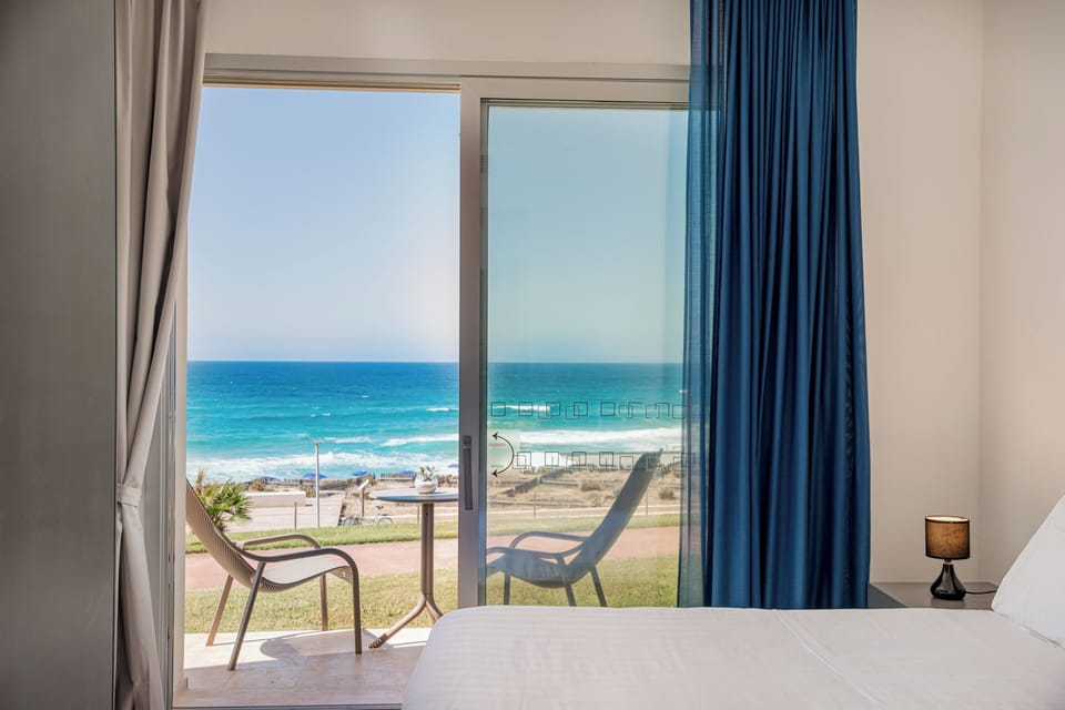 Superior Room (Front Sea View) | Desk, bed sheets