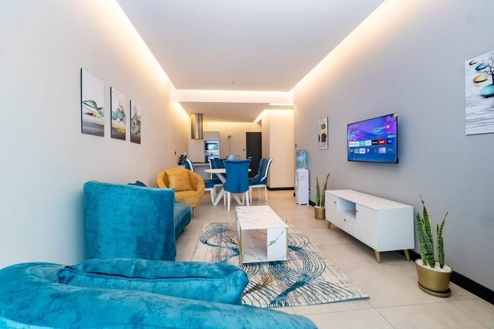 Deluxe Apartment | Living area | 24-inch Smart TV with digital channels