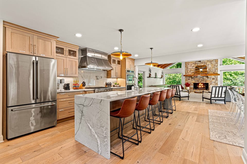 Fully stocked gourmet Kitchen open to two huge great rooms