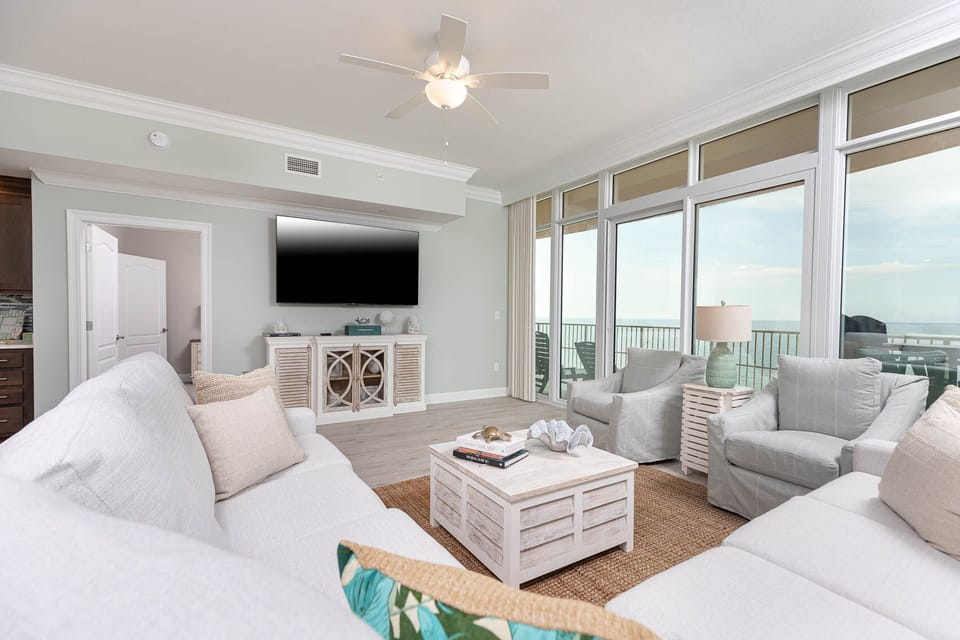 Sink into the sofa with full sleeper and stream shows while gazing at gulf views through floor-to-ceiling glass