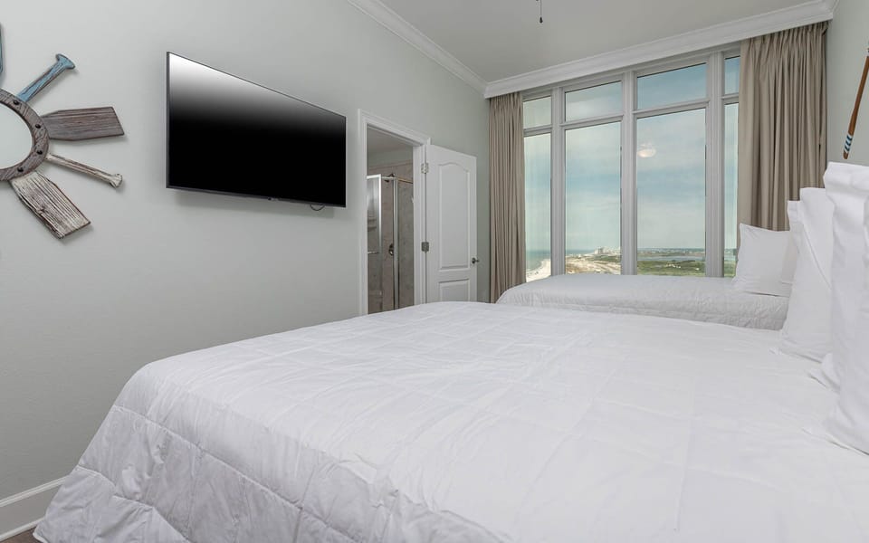 Stream your favorite shows to unwind after a day at the beach and relax with a coastline view from your queen guest room