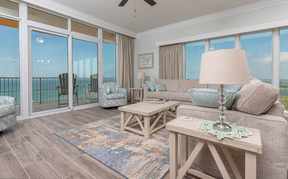 Relax on the cozy sofa with a queen sleeper in this inviting family room with breathtaking beachfront views