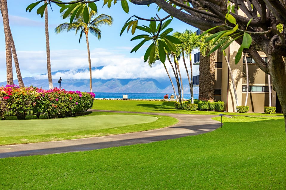 Putting green and sidewalks within Papakea