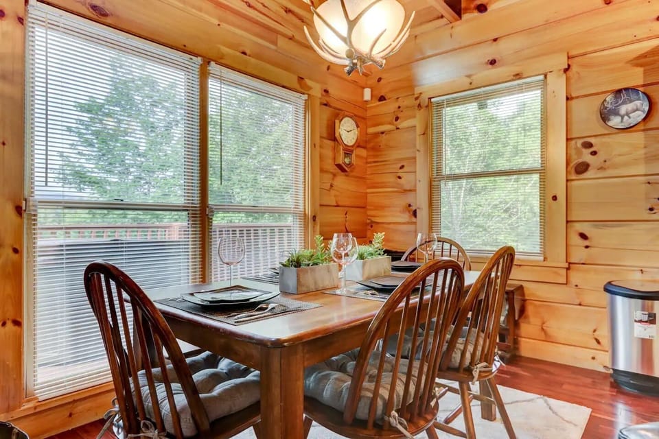 Dining area with tasteful light fixtures and decor