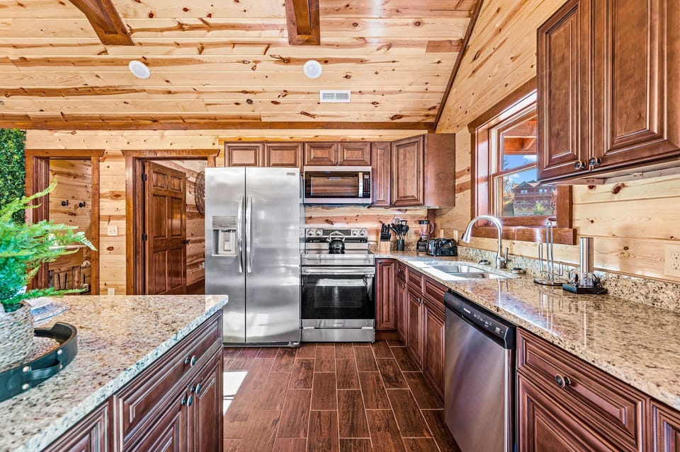 Fully equipped kitchen with two dual door refrigerators.