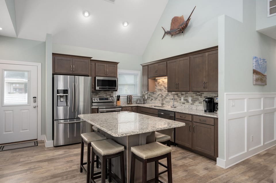 NH387B: Ocracoke Cottage | Kitchen and Dining Area- Island Seating for 6