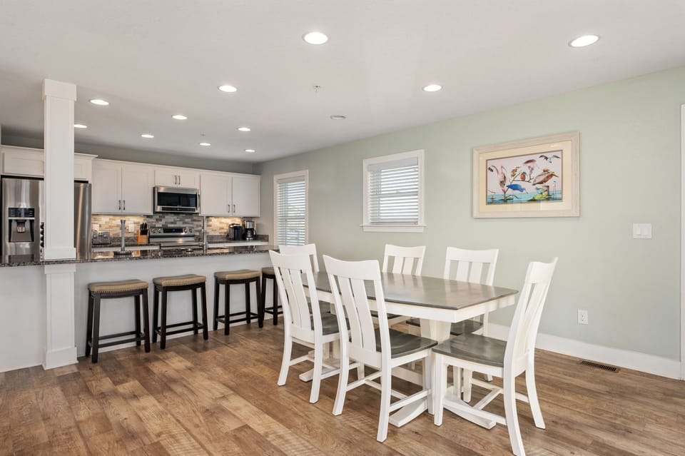 NH387F: Cape Hatteras Cottage | ML Living and Dining Area, Deck Access
