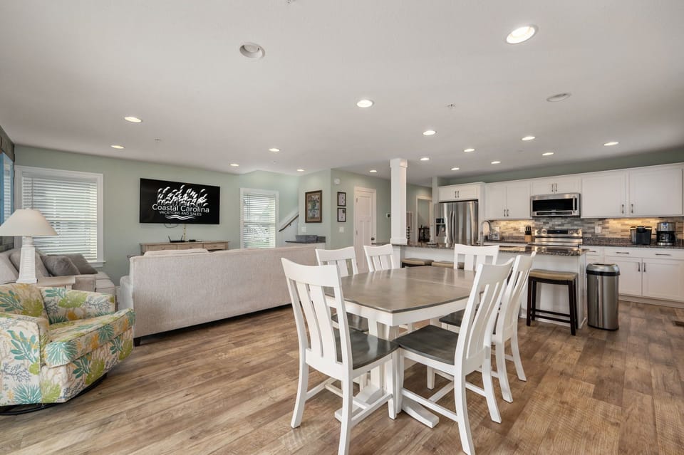 NH387F: Cape Hatteras Cottage | ML Living and Dining Area, Deck Access