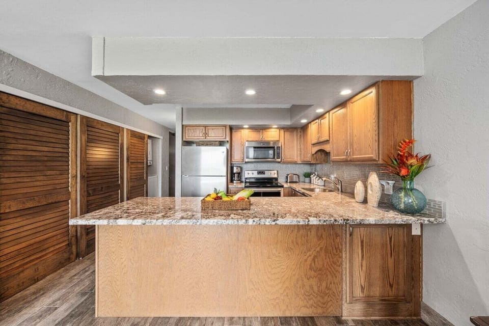 Stainless steel appliances compliment the updated countertops