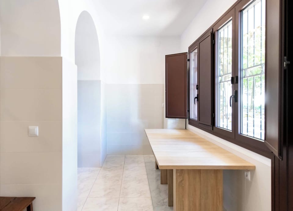 Airy corridor with built-in bench seating and abundant natural light