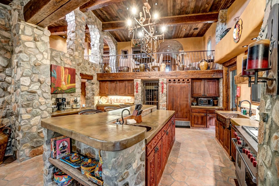 Chef's Kitchen with stone architecture throughout