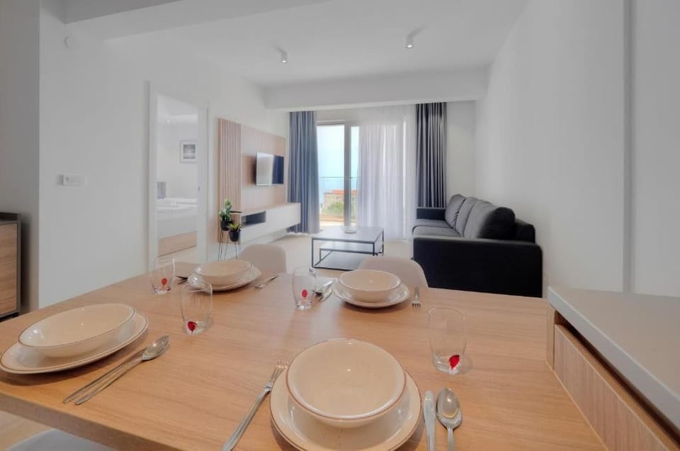 Exclusive Apartment | Living area | 32-inch LCD TV with cable channels