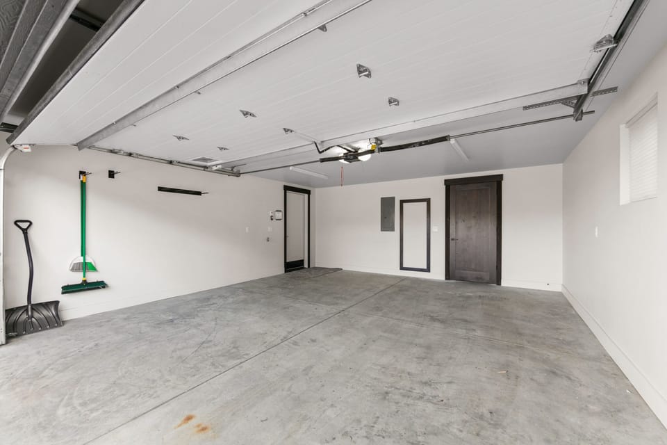 Spacious garage with room for your vehicles and extra storage needs during your stay.