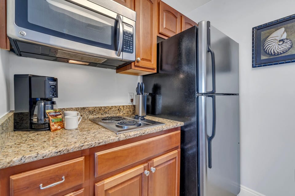 Your fully equipped kitchenette features granite countertops, stainless steel appliances, and everything you need to prepare meals during your stay.