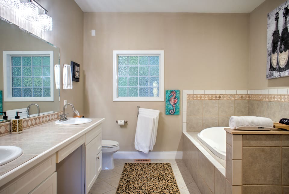 Main Suite/Bedroom One - Attached Full Bath w/ Walk-In Shower, Jetted Tub, and Dual Vanities