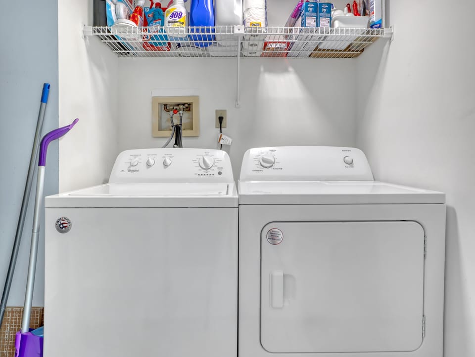 Full-sized washer and dryer in the utility room