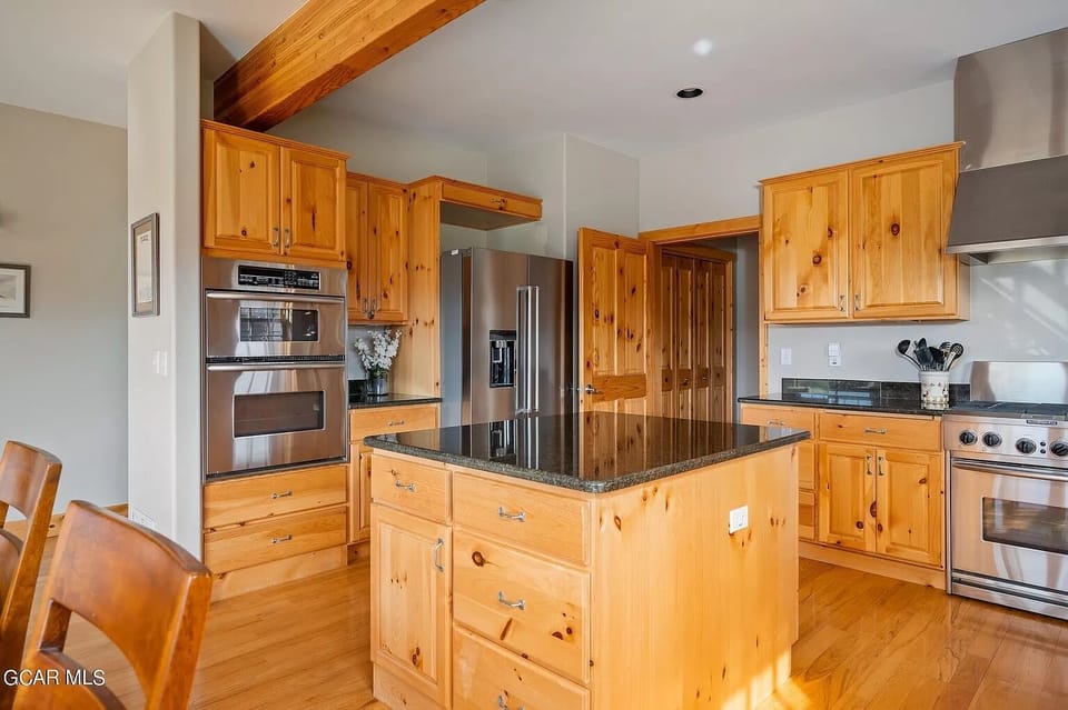 Two Ovens, One inside refridgerator, two garage fridge/freezers
