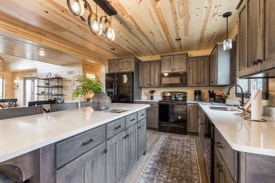 A spacious kitchen island and ample countertop area provide the ideal canvas for you to create the perfect meal!