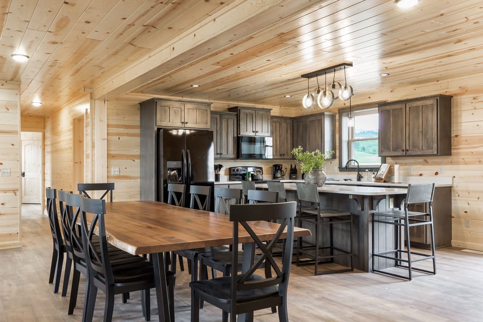 Past the dining room table is the gorgeous and fully-stocked kitchen.