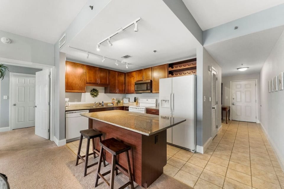Fully Stocked Kitchen with Lake Views and Island Bar Seating