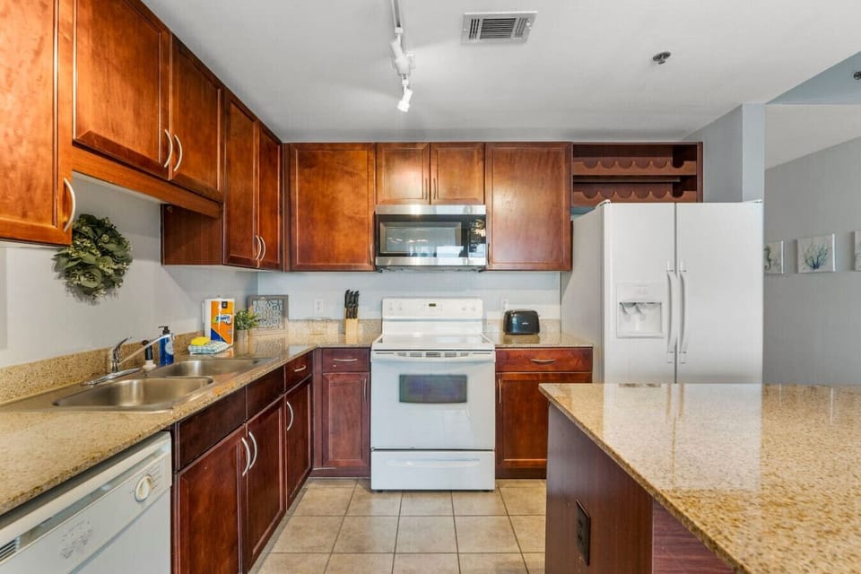Fully Stocked Kitchen with Lake Views and Island Bar Seating