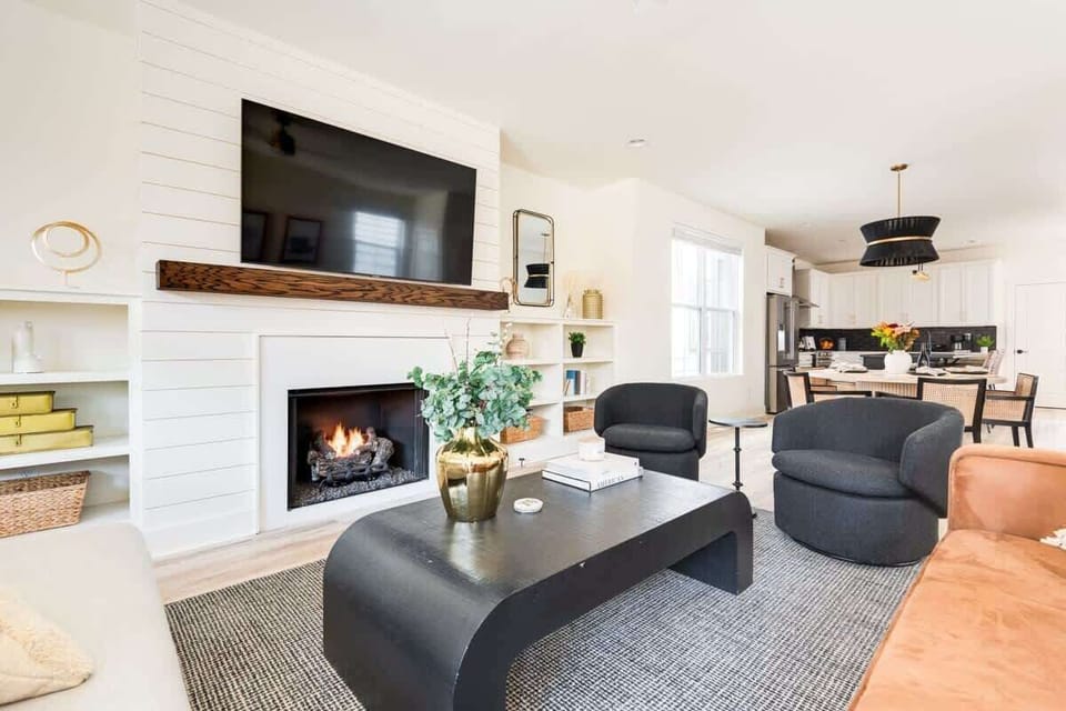 Tranquil Living Room with Modern Design and a Warm Fireplace Glow