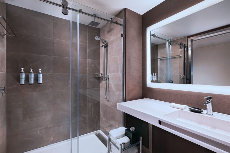 Shower, hydromassage showerhead, hair dryer, towels