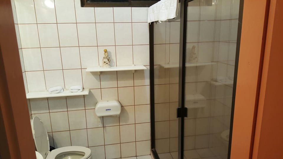 Standard Triple Room, 1 Bedroom | Bathroom | Shower, free toiletries, hair dryer, towels