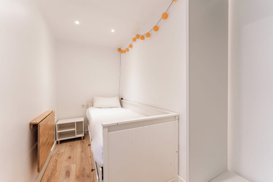 Family Apartment | Down comforters, desk, blackout drapes, iron/ironing board