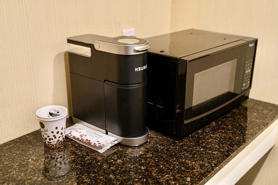 Minibar, desk, laptop workspace, iron/ironing board