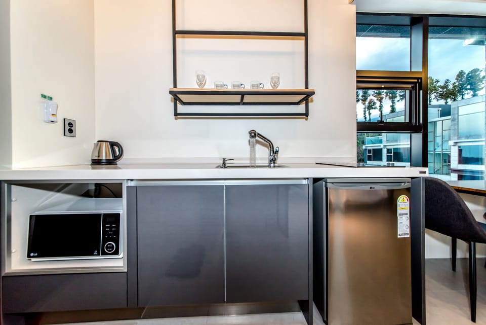 Deluxe Room (Spa, Pet Unfriendly) | Private kitchen | Fridge, microwave, electric kettle, rice cooker