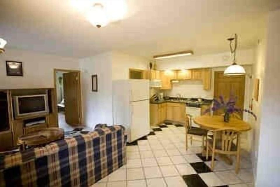Superior Suite, 1 King Bed, Jetted Tub | Private kitchen | Coffee/tea maker, full-size fridge, microwave, oven