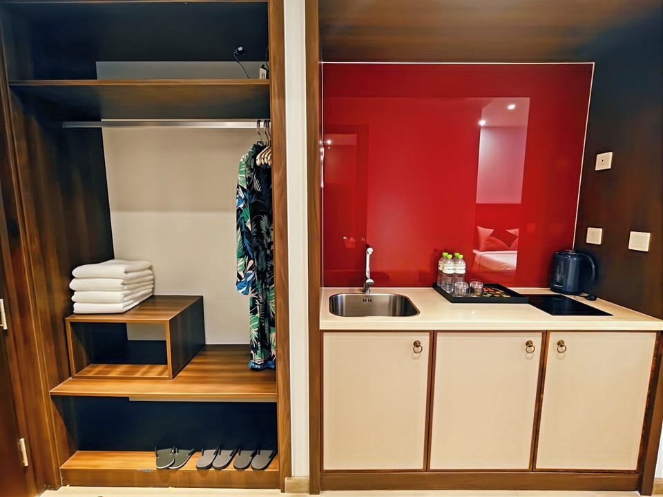 Quadruple Room, 2 Queen Beds, Garden View | Private kitchen | Mini-fridge, microwave, electric kettle, eco-friendly cleaning products