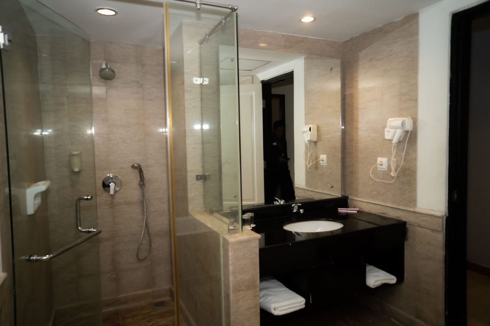 Shower, free toiletries, hair dryer, slippers