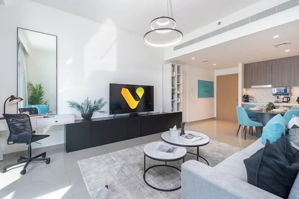 Luxury Apartment | Living area | 65-inch Smart TV with cable channels