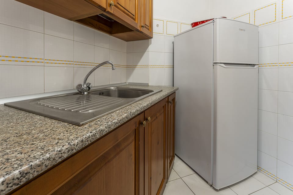 Apartment | Private kitchen | Full-size fridge, stovetop, cookware/dishes/utensils, freezer