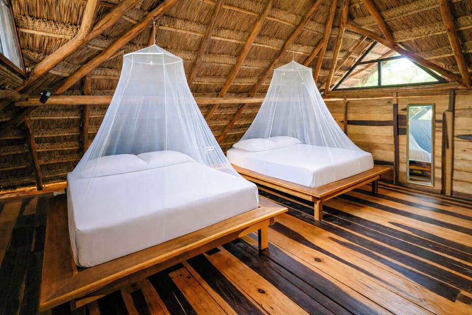 Deluxe Bungalow, 2 Queen Beds, Terrace, Mezzanine | 1 bedroom, pillowtop beds, free minibar, laptop workspace
